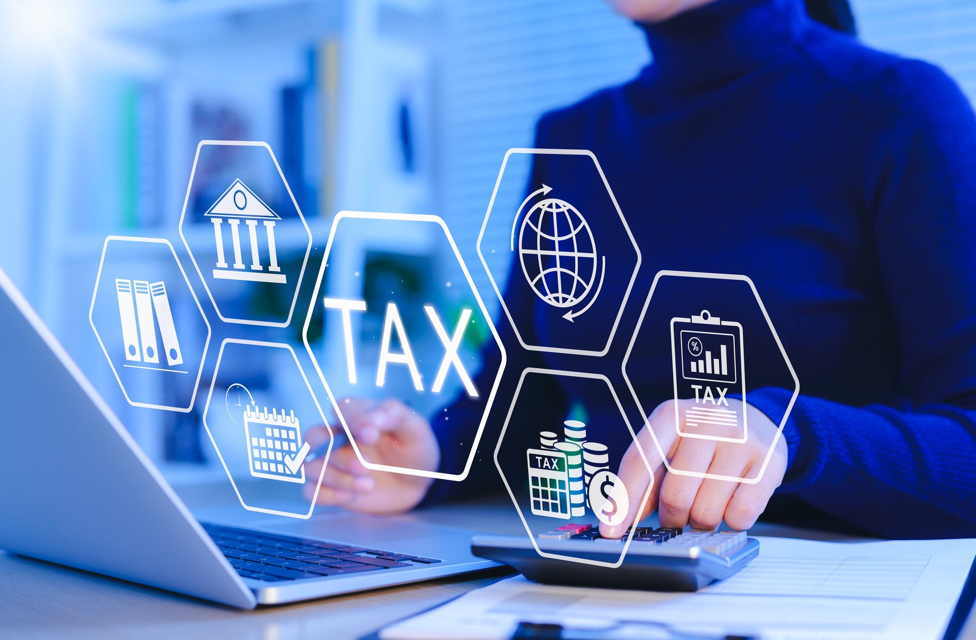 Tax calculation and financial management concept. Woman using laptop and calculator with digital tax icons, financial documents, currency, and government, representing tax filing, finance, accounting,