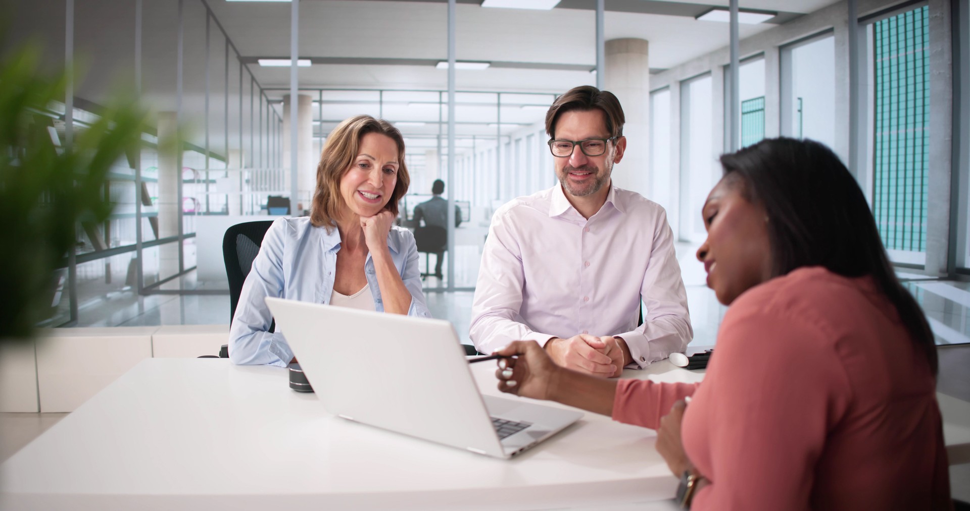 Happy Couple Discussing Financial Planning with Tax Accountant