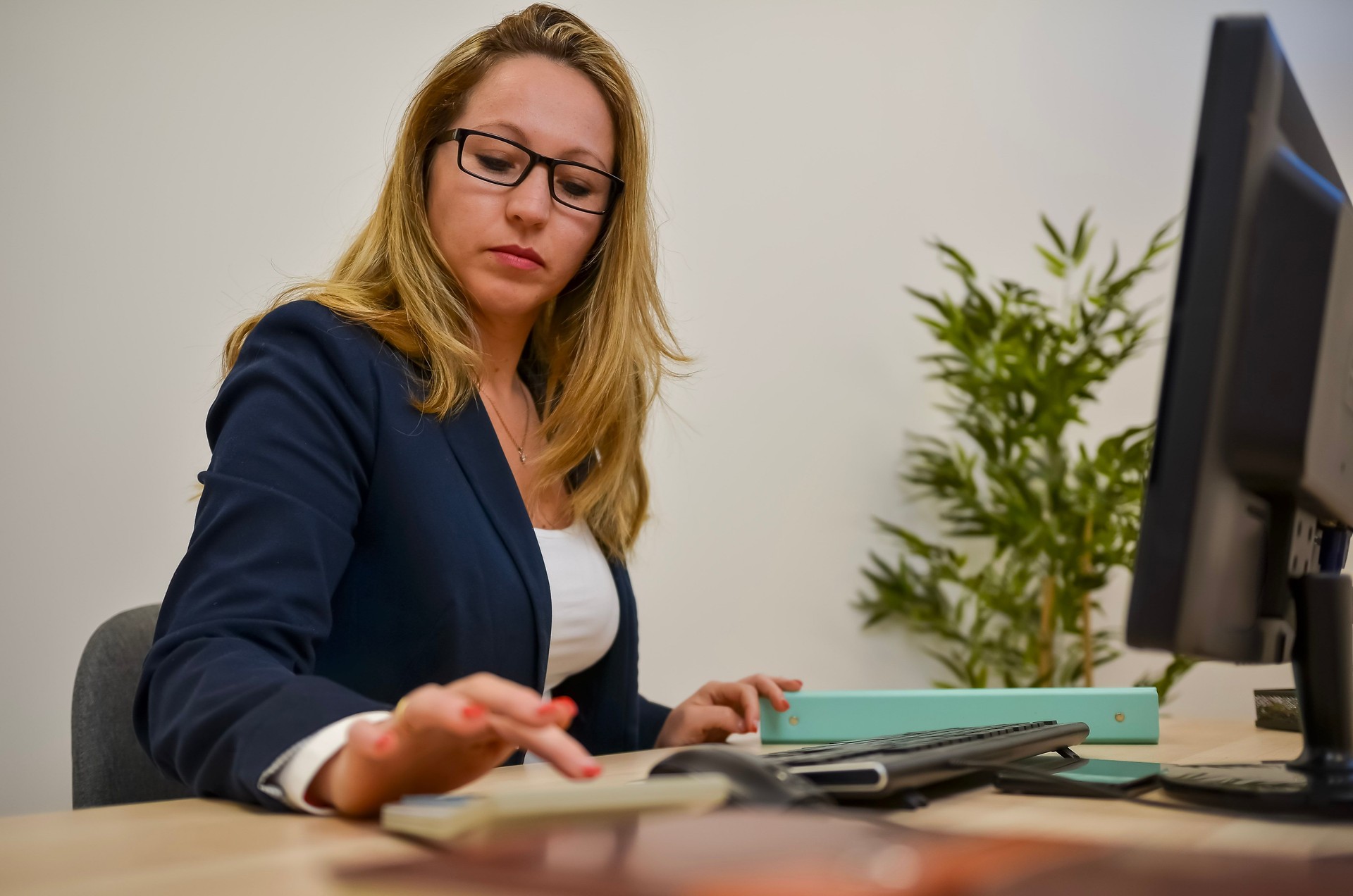 Accountant calculating taxes in her office