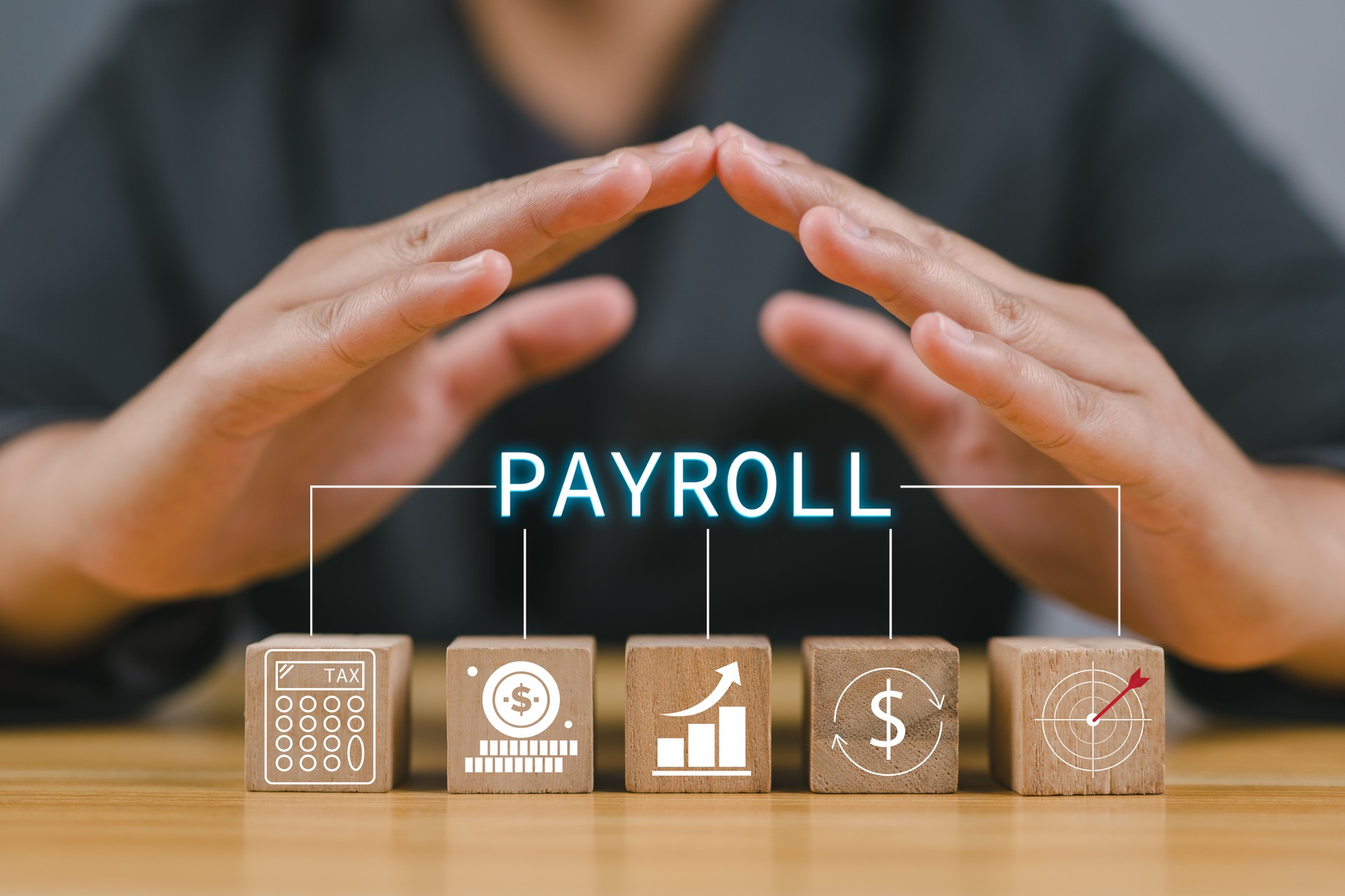 Payroll business finance concept, Businessman with Wooden block on desk with Payroll icon on VR screen, Financial, accounting.
